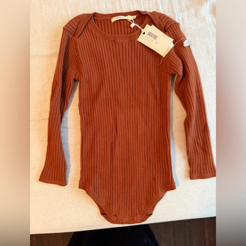Fragile baby onesie